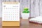 The December 2022 Monthly desk calendar for 2022 year with open diary wooden background