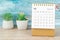 The December 2022 Monthly desk calendar for 2022 year with plant pot