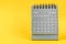 The December 2022 Monthly desk calendar for 2022 year on yellow background