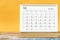 The December 2022 Monthly desk calendar for 2022 year on yellow background