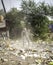 December, 2022, Raipur, India: Man sweeping the trash with broom and polyhthene big garbage area,