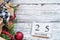 December 25th Calendar Blocks against White Rustic Background