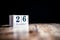 December 26th, 26 December, Twenty Sixth of December - White block calendar on vintage table - Date on dark background