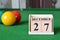 December 27, number cube with balls on snooker table, sport background.