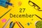 December 27th. Day 27 of december month. Calendar on yellow businessman workplace background. Winter time