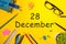 December 28th. Day 28 of december month. Calendar on yellow businessman workplace background. Winter time