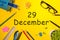 December 29th. Day 29 of december month. Calendar on yellow businessman workplace background. Winter time