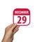 december 29th. Day 29 of month,hand hold simple calendar icon with date on white background. Planning. Time management. Set of