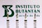 December 4, 2020, Brazil. In this photo illustration various medical syringes is seen with Instituto Butantan company logo