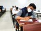 December 8, 2020.Lucknow Uttar Pradesh,India. West Bengal India. Medical students writing examination paper in mask