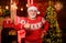 December sale. Santa Claus. Gift shop. Man senior Santa claus wear sweater with nordic pattern. Winter traditions