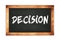 DECISION text written on wooden frame school blackboard