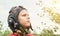 Decisive boy in vintage pilot helmet looks into sky in park