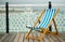 Deck chair on Brighton pier promenade.