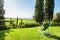 Deck chair on the green meadow