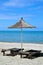 Deck chairs and umbrella on a sandy beach