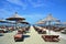 Deck chairs and umbrellas on a sandy beach