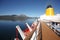 Deck & funnel of a ship as it cruises fjords, islands & inside passages, between Bodo & Hammerfest, Norway.