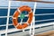 Deck and railing of a cruise ship with lifebelt