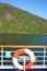 Deck of a ship & life ring as it cruises down the Sognefjord or Sognefjorden, Vestland county in Western Norway,.