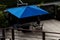 Deck in wood with outdoor pool tables with blue umbrellas minimalist construction