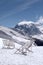 Deckchair in snow in a snow-covered mountain landscape