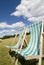 Deckchairs in a green lawn