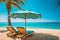 Deckchairs and parasol with palm trees in tropical beach