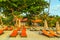 Deckchairs and parasol tropical beach sea landscape, romantic paradise