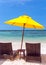 Deckchairs and parasol tropical beach sea landscape, romantic paradise