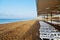 Deckchairs stand in a row on the beach, without people, early morning, concept trip, vacation.