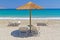 Deckchairs under parasol at Aegean Sea