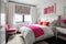 decluttered bedroom with crisp, white sheets and hot pink accents