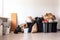decluttering room, with bin and bags for donations or trash