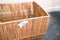 Decluttering and tidying up concept, storage basket with Declutter or Donate label on it and nothing inside of it