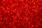 Decompressed abstract red glitter background