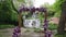 decor of the arch for the wedding ceremony with lilac flowers near waterfall