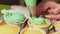 Decorate lemon cupcakes with mint cream based on curd cheese