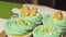 Decorate lemon cupcakes with mint cream cut in half mini tangerine