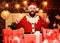 Decorate your christmas with joy. Cheerful Santa with gifts. Bearded Santa Claus. Man wear Santa costume. Holidays