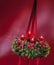 Decorated advent wreath on red background