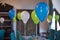 Decorated balloons for birthday. View of an empty blue boyl baptism celebration. B irthday party of a baby concept made of