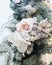 Decorated beautiful white flowers and christmas tree branches, bright interior with decorations on the background