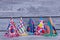 Decorated Birthday hats on wooden background.