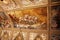 Decorated ceiling with frescos of a cart with horses in the museum Palazzo Te in Mantova, Italy