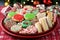 decorated christmas cookies on a festive platter with candies