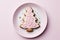 Decorated Christmas cookies in the shape of a Christmas tree,sweet tradition,solid background