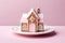 Decorated Christmas cookies in the shape of a house,pink glaze,tradition,solid background