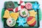 Decorated Christmas Cut Out Cookies on Green Glass Platter
