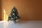 Decorated Christmas tree in a bare room interior